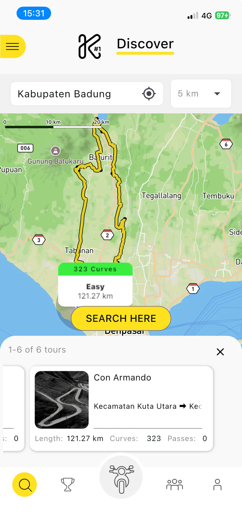 Old Discover tab with a selected tour: the route highlighted in yellow on the map with a 323 Curves label, a Search Here button, and a horizontal row of tour cards.