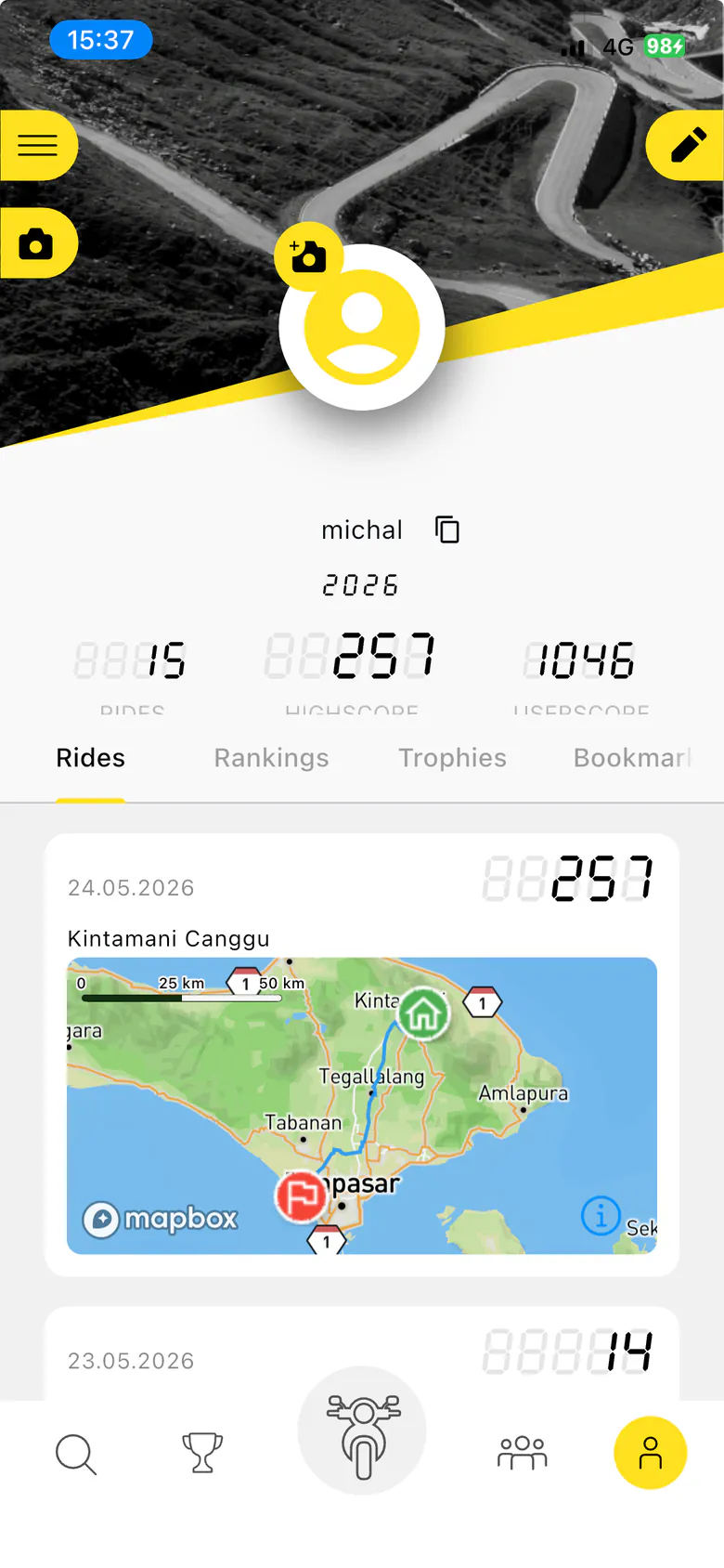 Old My Profile screen: a header photo with a yellow avatar, the rider's name, the 2026 rides, highscore and userscore counters, and Rides, Rankings, Trophies and Bookmarks tabs above a list of rides.